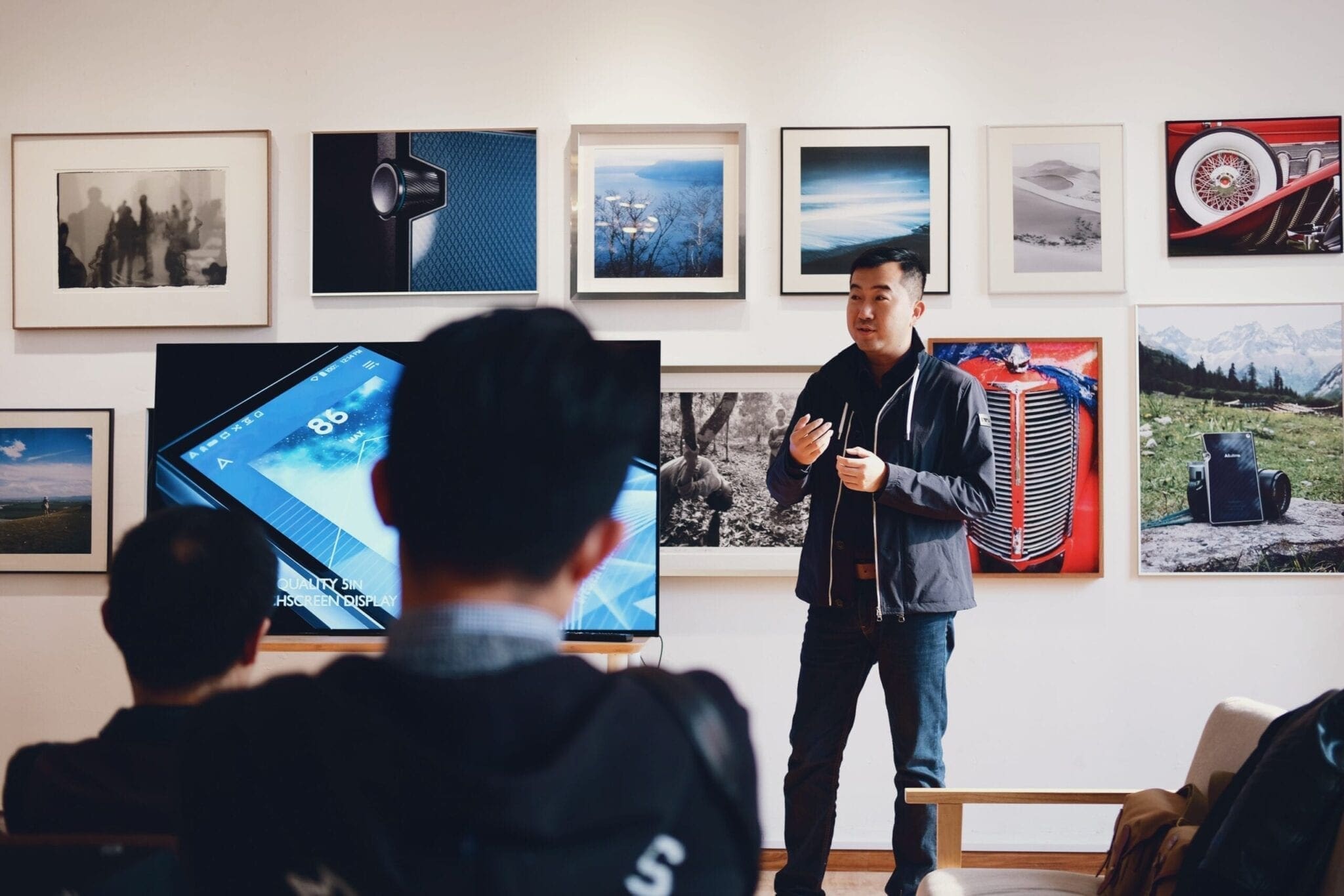 man speaking in front of a group